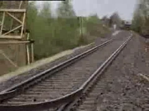 Kids make a roller coaster loop on the train tracks