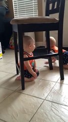 Baby stuck under chair comes up with genius idea