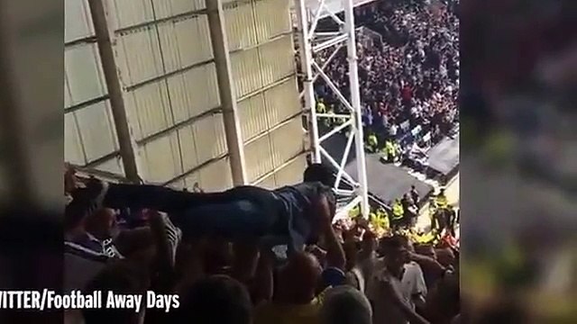 Watch a Leeds fan CROWD SURF all the way from the very top of Preston's away end