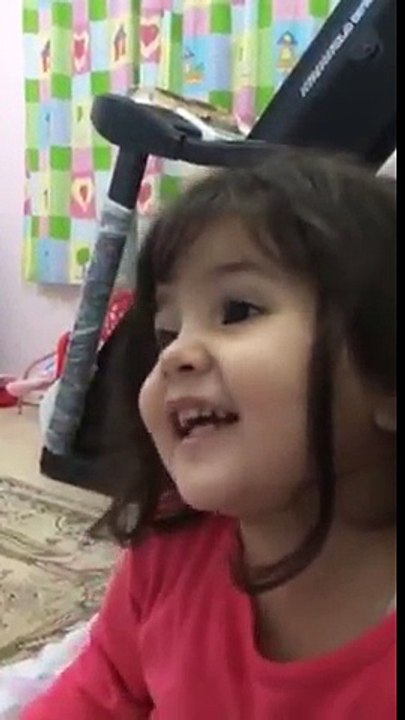 Cute little girl reading Surah An-Naas