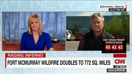 Thousands flee growing Fort McMurray wildfire