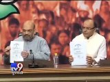 PM Modi's degree flashed by Amit Shah as BJP attacks Arvind Kejriwal, demands apology - Tv9