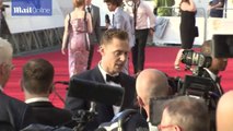 Tom Hiddleston mixing with his fans attending the BAFTAs