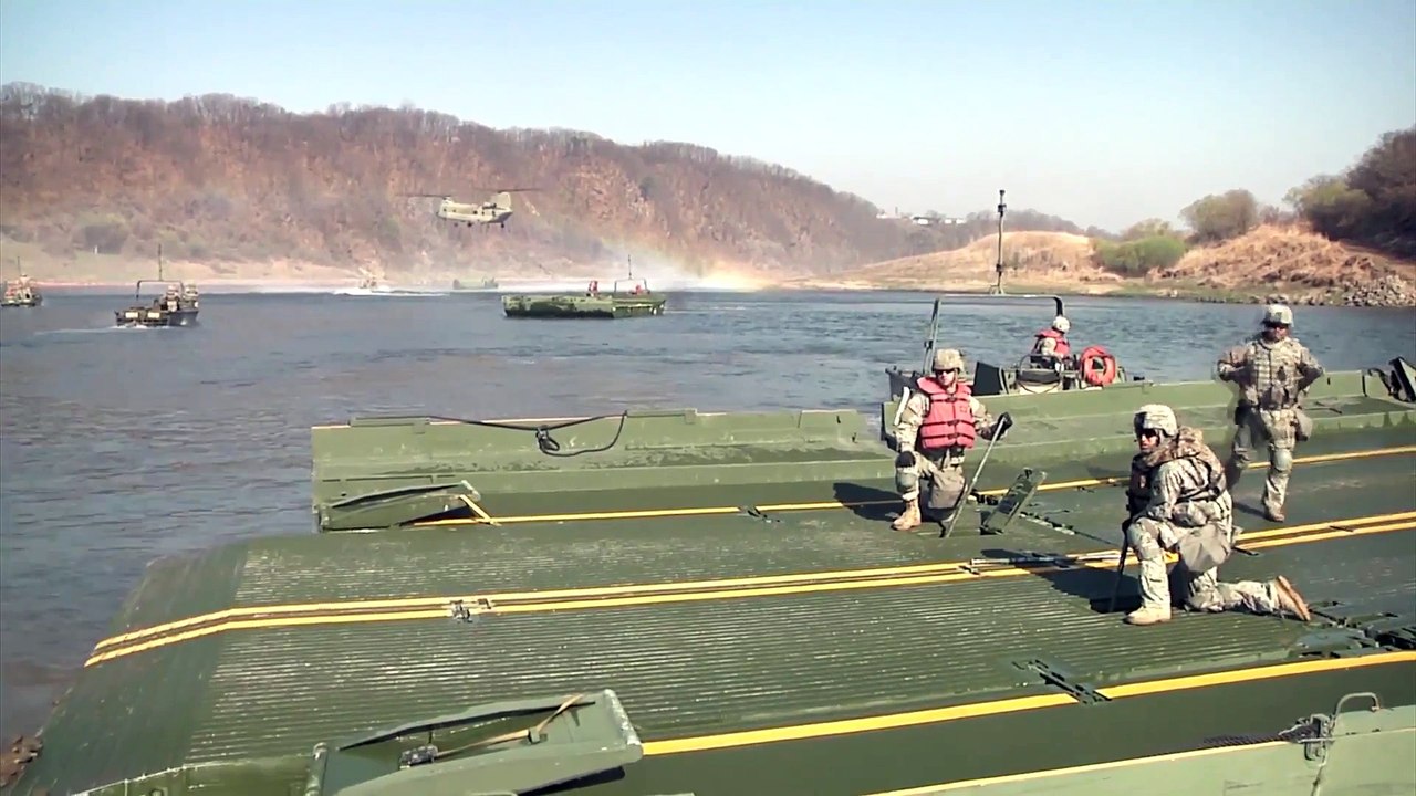US Marines Building a Bridge on Water for the Massive M1A Abrams Tank and the Bradley With a Chinook Helicopter