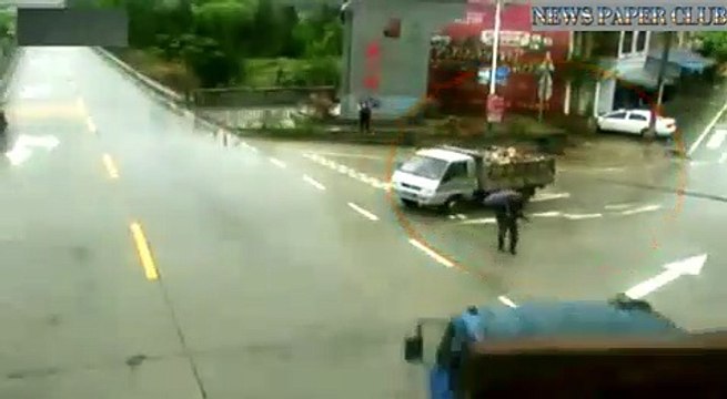 Old man blissfully unaware as out-of-control dump truck almost flattens him