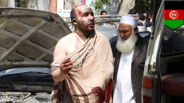 At least 70 people killed in Afghanistan bus crash as vehicles engulfed in flames