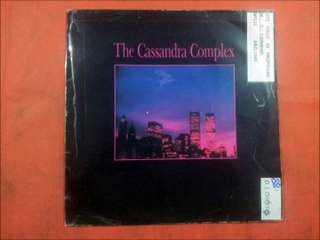 THE CASSANDRA COMPLEX.''THEOMANIA.''.(ONE MILLIONTH HAPPY CUSTOMER.)(12'' LP.)(1988.)