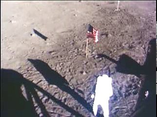 An Apollo 11 astronaut collects lunar samples