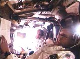 Apollo 11 astronauts Neil Armstrong and Buzz Aldrin at work in the Command Module