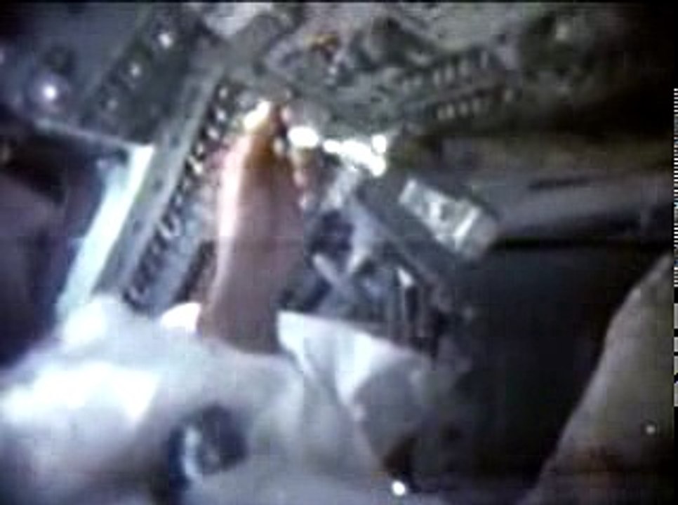 Apollo 11 commander Neil Armstrong demonstrates the unusual behavior of water in microgravity.