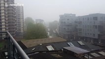 City of London skyline shrouded by heavy fog