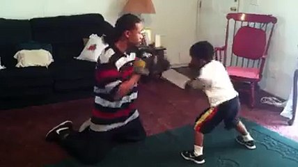 Boxer kid fighting with dad: