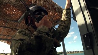 US Marine Aboard the Little But Very Fast US Navy Patrol Boat Armed With M2 Machine Gun .50 Caliber