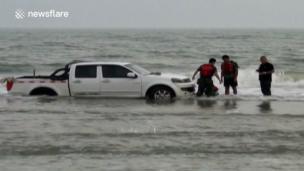 Pickup truck trapped on a beach for eight hours