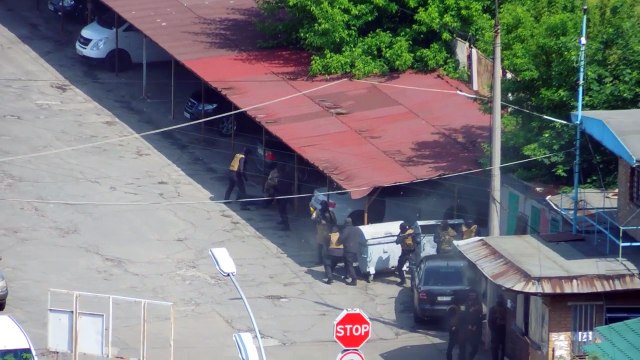 Взрыв на автостоянке в Киеве: появилось жуткое видео перестрелки