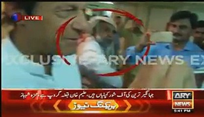 Who is this Man and What he is Saying to Imran Khan --