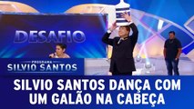 Silvio Santos dança com um galão na cabeça