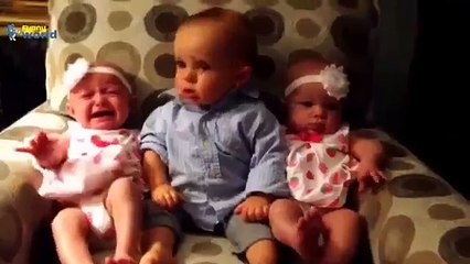 Baby sees baby twins for the first time