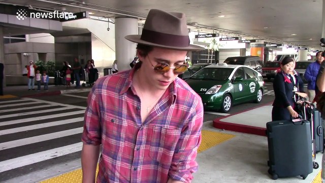 Brooklyn Beckham mobbed by paparazzi at LAX Airport