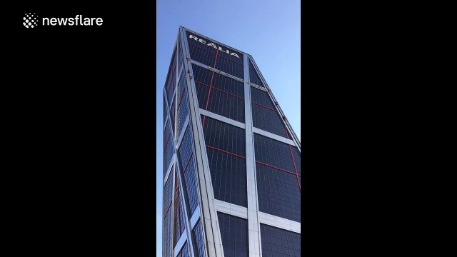 Greenpeace activists climb Madrid building to protest TTIP