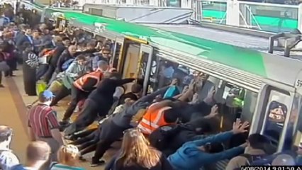 Mind the gap- Commuters push train to save trapped man in Perth