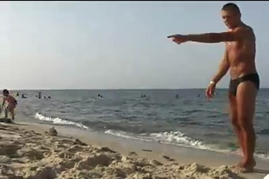 Shooting a bottle right next to my sister´s head on the beach