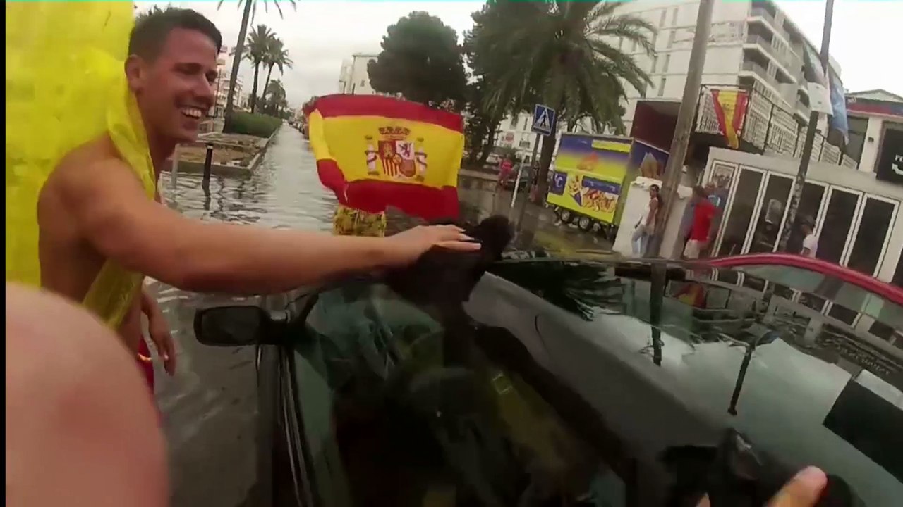 Guys get crazy in Ibiza after the big rain
