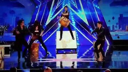 Guy swinging his hands in audience - Malevo Performance AGT