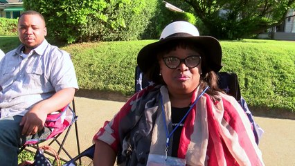 Fans watch funeral procession pass Muhammad Ali's childhood home