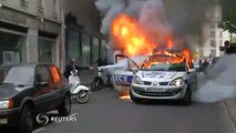 Proteste violente fata de politie la Paris o masina a fost atacata si incendiata in timp ce doi agenti se aflau inauntru