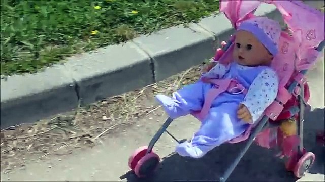 Baby doll sitting round trip walk to slide down the slide at a playground swing