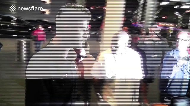 Kim Kardashian and Kanye West get mobbed by the paparazzi at LAX Airport