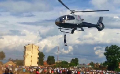 Spectator Hangs Onto a Flying Helicopter