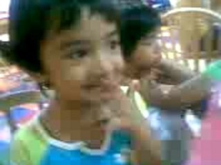 Rithu & Ridhu eating nachos at inflatable