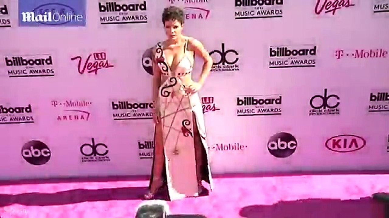 Halsey shows she's blessed in bust department in white dress