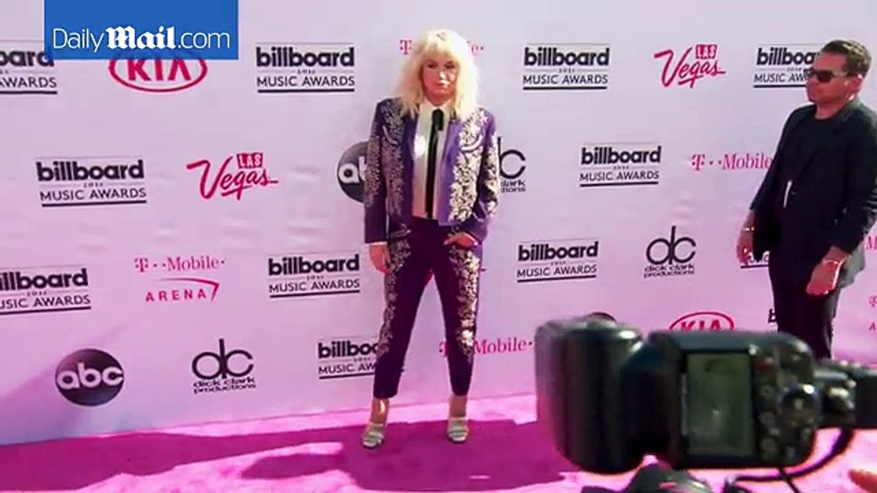 Kesha arrives at 2016 Billboard Music Awards in matador look