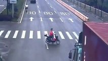Lucky Woman escaped after truck crushes scooter in China