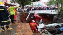Sinkhole 'swallows' four cars in China