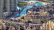 Top view of the bridge over man-made lake timelapse in Dubai downtown, United Arab Emirates