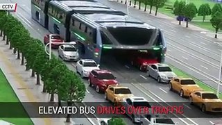 elevated chineese bus that drives over traffic