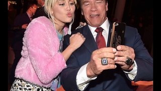Miley Cyrus reunites with ex dad Arnold Schwarzenegger cuddle up for a selfie.