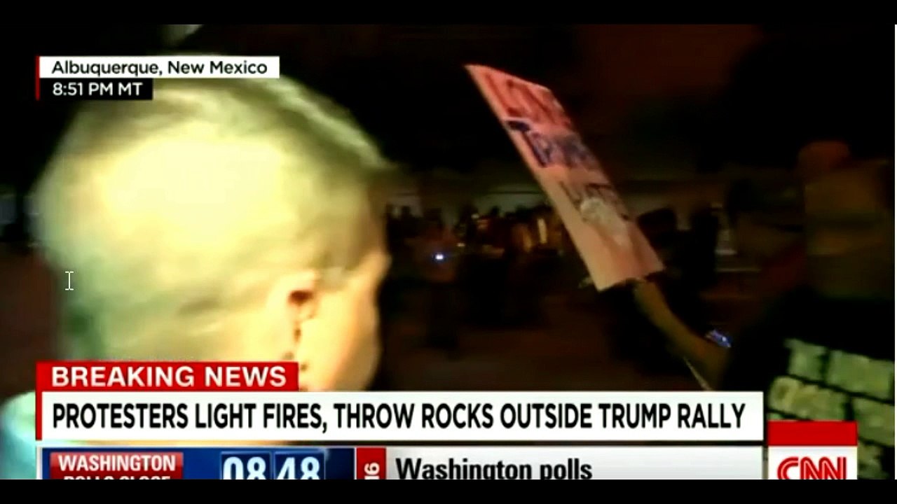 Protesters break through barriers, light fires, throw rocks outside Trump rally in Albuquerque, NM.1