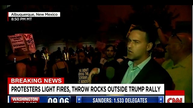 Anti-Trump Protesters Break Down Barrier, Light Fires, Throw Rocks at Police