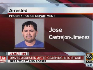 Driver arrested after crashing into store