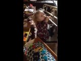 Little Girl Tries to Play Trombone That's Almost as Big as She Is