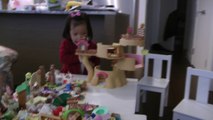Girl Playing Sylvanian Families Baby Tree House