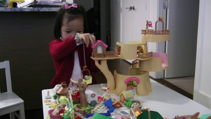 Girl Playing Sylvanian Families Baby Tree House