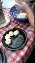 Rolling up rosemary cheddar biscuits