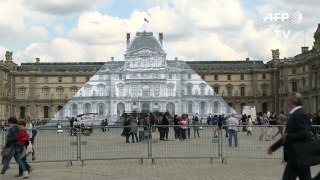 Pyramid at Louvre Museum covered by 'trompe-l'oeil' art