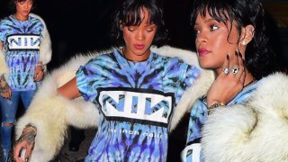 Rihanna combines two very different styles as she teams fur wrap with tie dye band tee